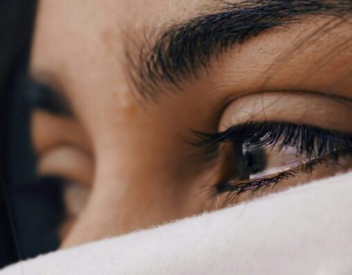 shallow focus of a woman's sad eyes